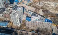 3 корпус выглядит как 2  отдельных здания. Между собой они соединены 2-этажным "переходом". Аэрофотосъемка от 14.04.2018.