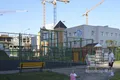 Спортивная площадка и детский сад.
