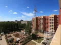 Вид на строящийся корпус жилого комплекса, открывающийся из окна. Фото от 25.07.2014 г.